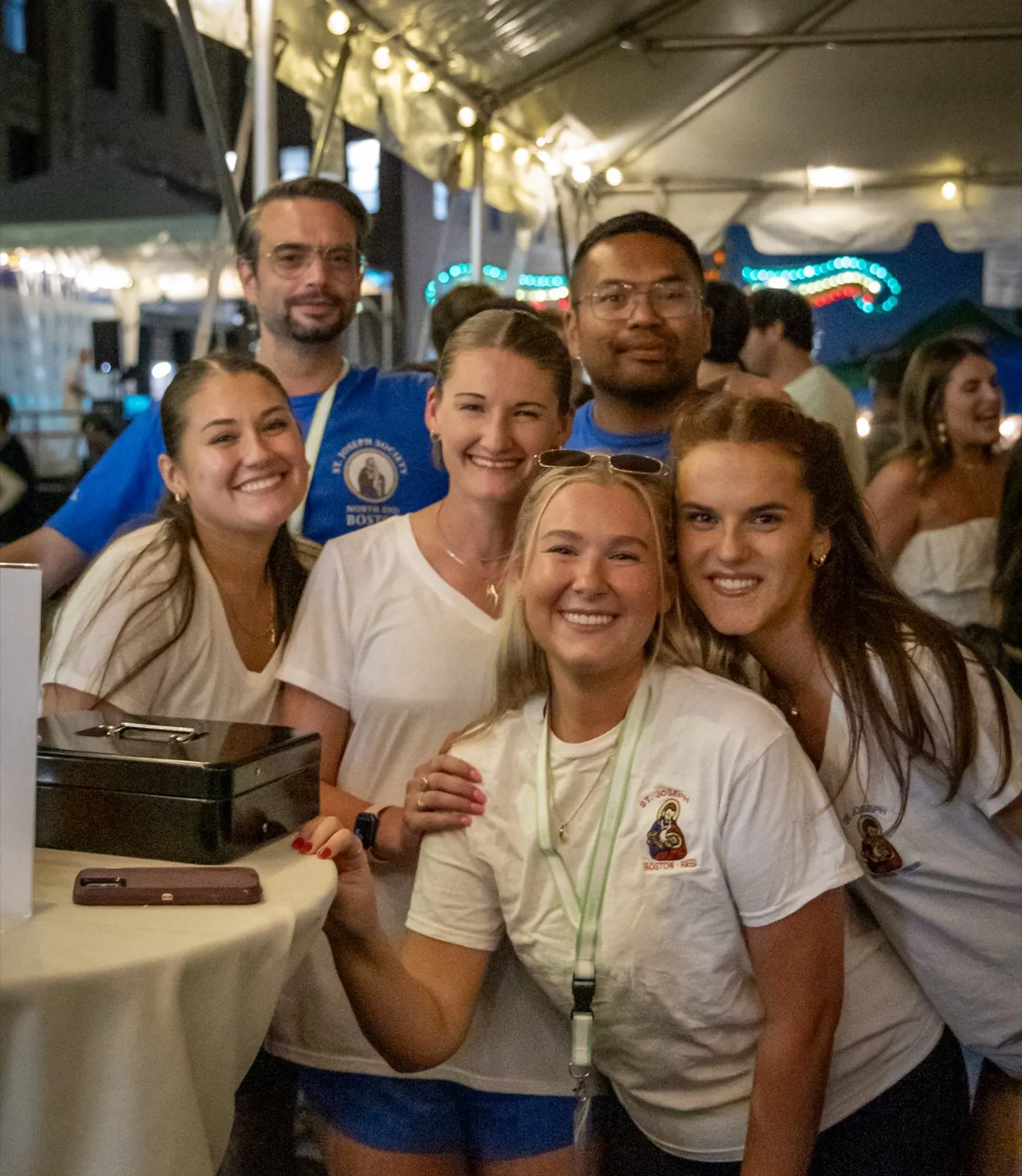 Volunteers under the Feast lights